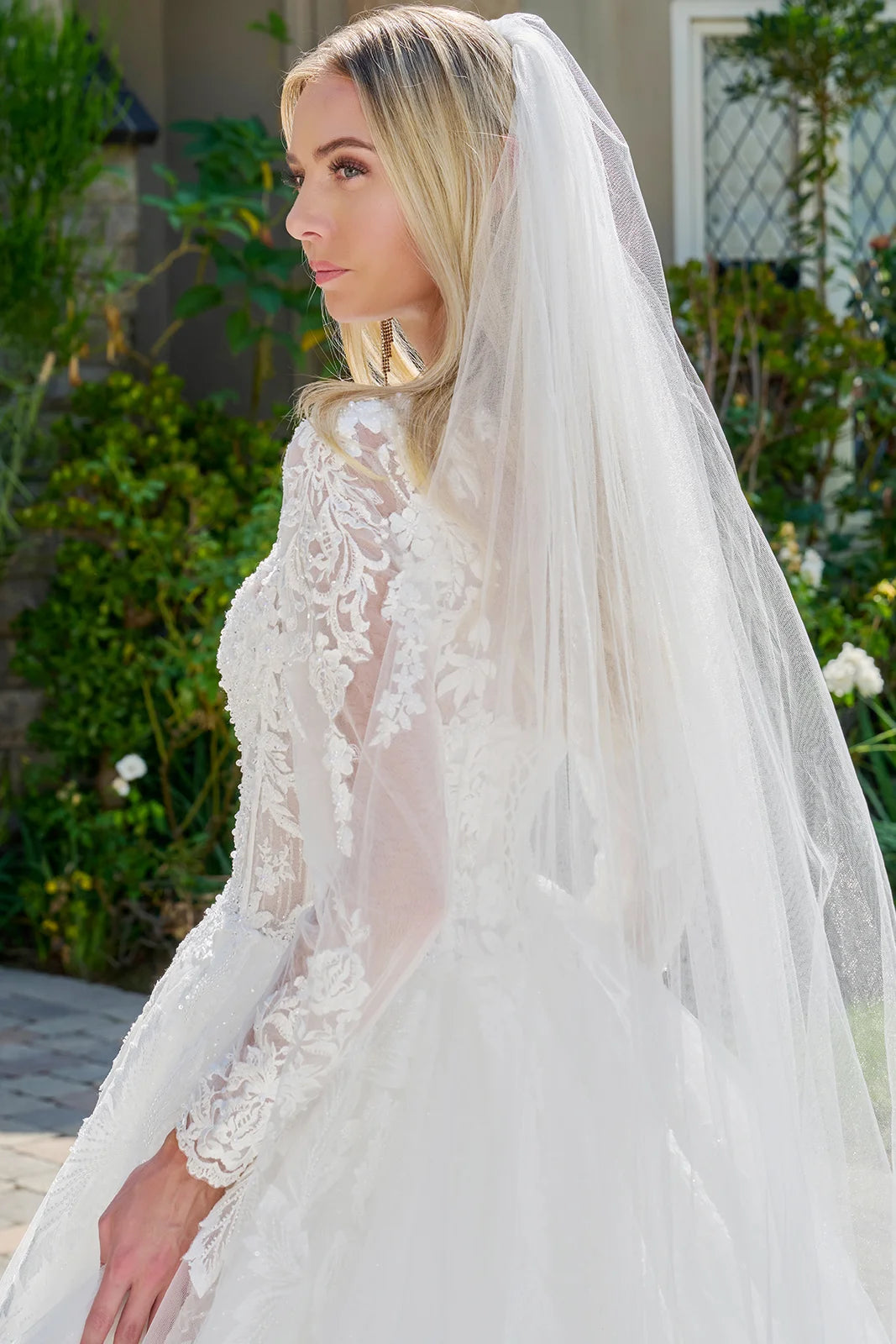 Wedding Dress Made Of Transparent Mesh, With Long Sleeves, A Round Neckline, And A Corset-Style Bodice.