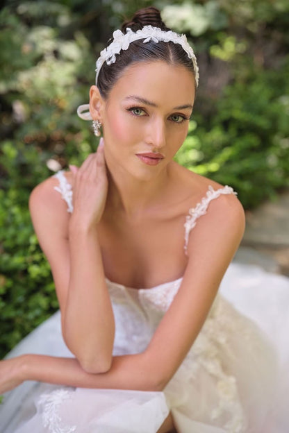 A-line wedding gown plunging illusion neckline and delicate floral straps corset bodice